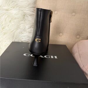Coach Black Leather Ankle Boots with Gold Accent